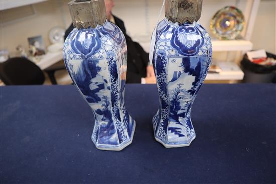 A pair of Chinese blue and white canted rectangular baluster vases, Kangxi period, H.26.7cm, one neck with section lacking obscured by